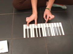 Cute teen plays piano and pussy on the floor